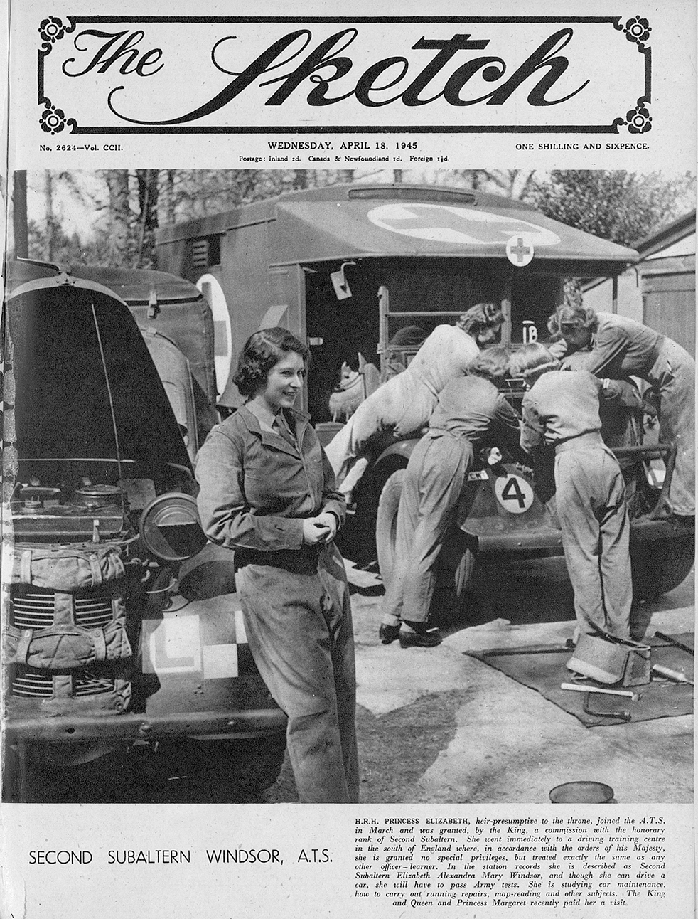 A black and white photograph of the young Princess Elizabeth leaning against a motor vehicle with the bonnet up. She wears overalls and a group of women in the background, in similar dress, can be seen leaning over the open bonnet of another vehicle.
