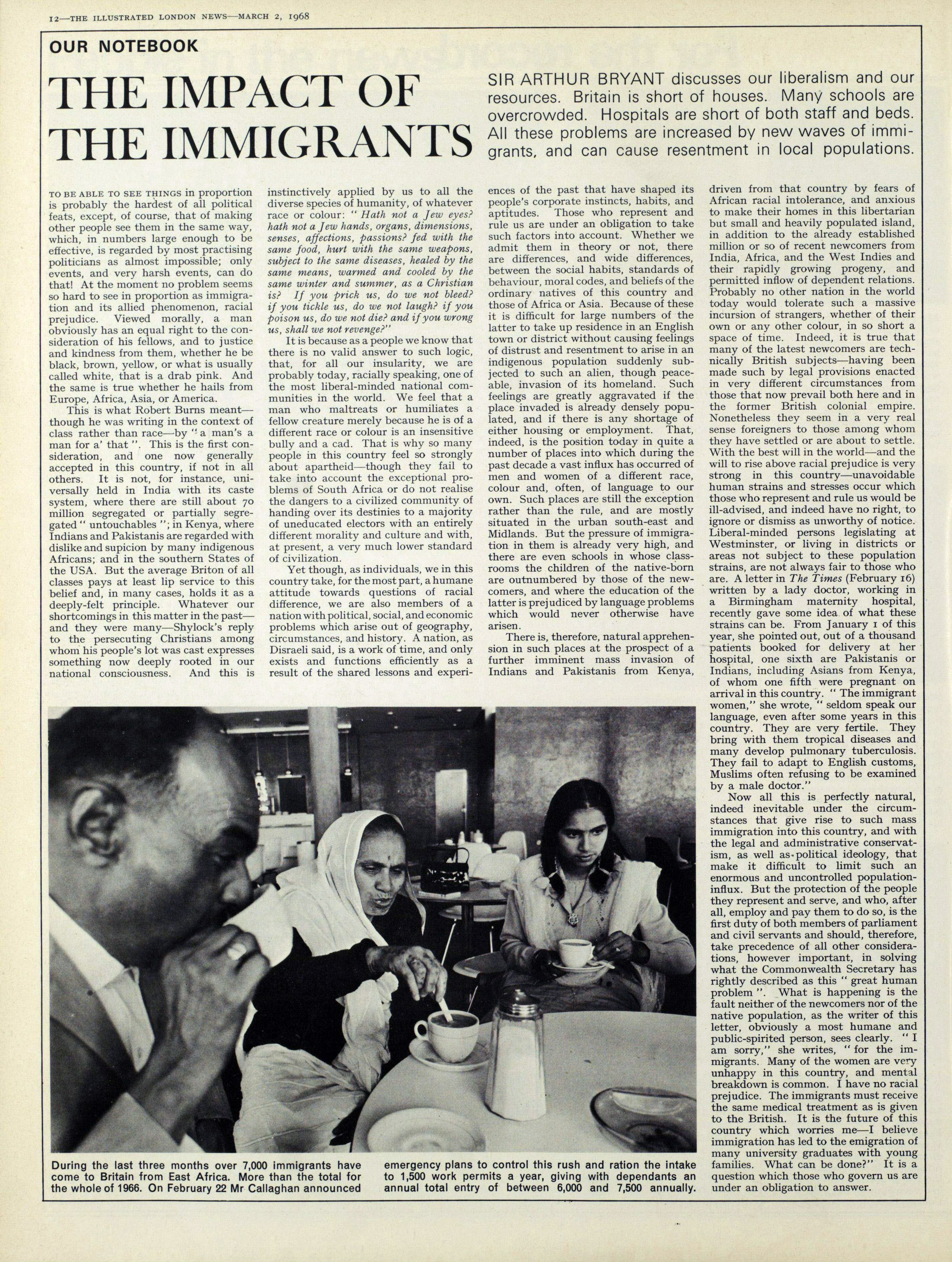 An article titled "The Impact of the Immigrants". There are four columns of text, and a photograph of an immigrant family sat around a table enjoying a cup of tea together.