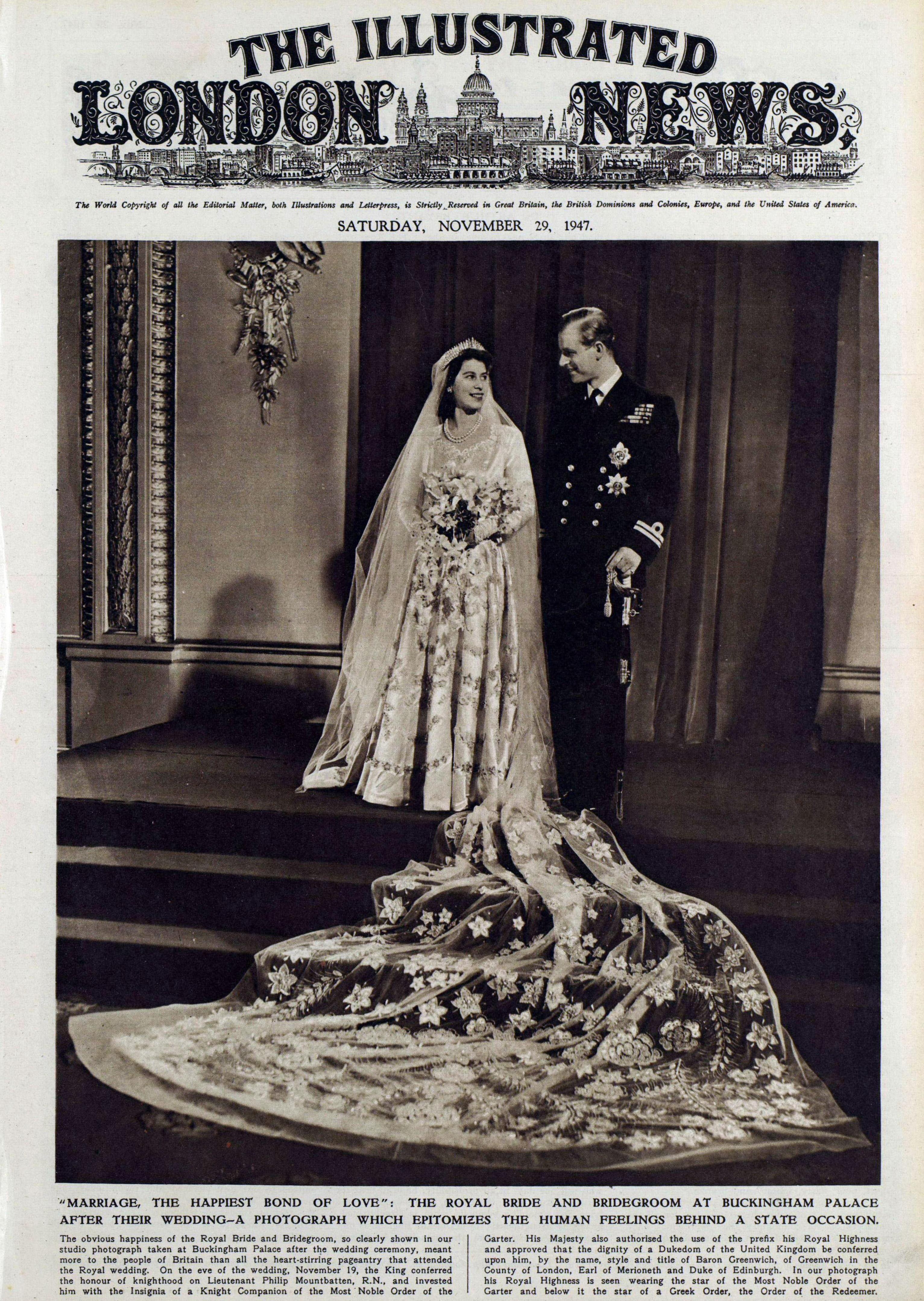 A page from The Illustrated London News, 29 November 1947, featuring a large photograph of Queen Elizabeth II and Prince Philip on their wedding day. A caption below reads ""Marriage, the Happiest Bond of Love": The Royal Bride and Bridegroom at Buckingham Palace After Their Wedding - A Photograph which Epitomizes the Human Feelings Behind a State Occasion". Two small columns of text feature beneath this.