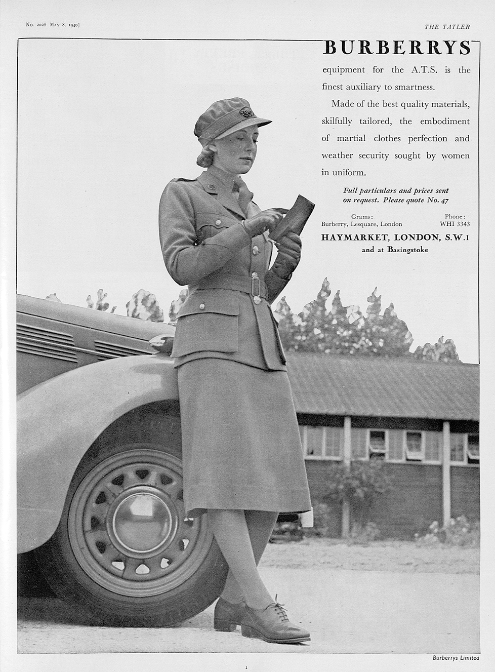 A photograph of a woman leaning against the wheel arch of a car. The photo is taken from a low angle, showing off the woman's clothing. She wears a long, A line skirt, with brogues and a collared tunic. She has leather gloves, in which she holds a piece of paper which she is pointing to. She is wearing a peaked cap with her hair neatly tucked away. Above the photograph, is a title that says "Burberrys".