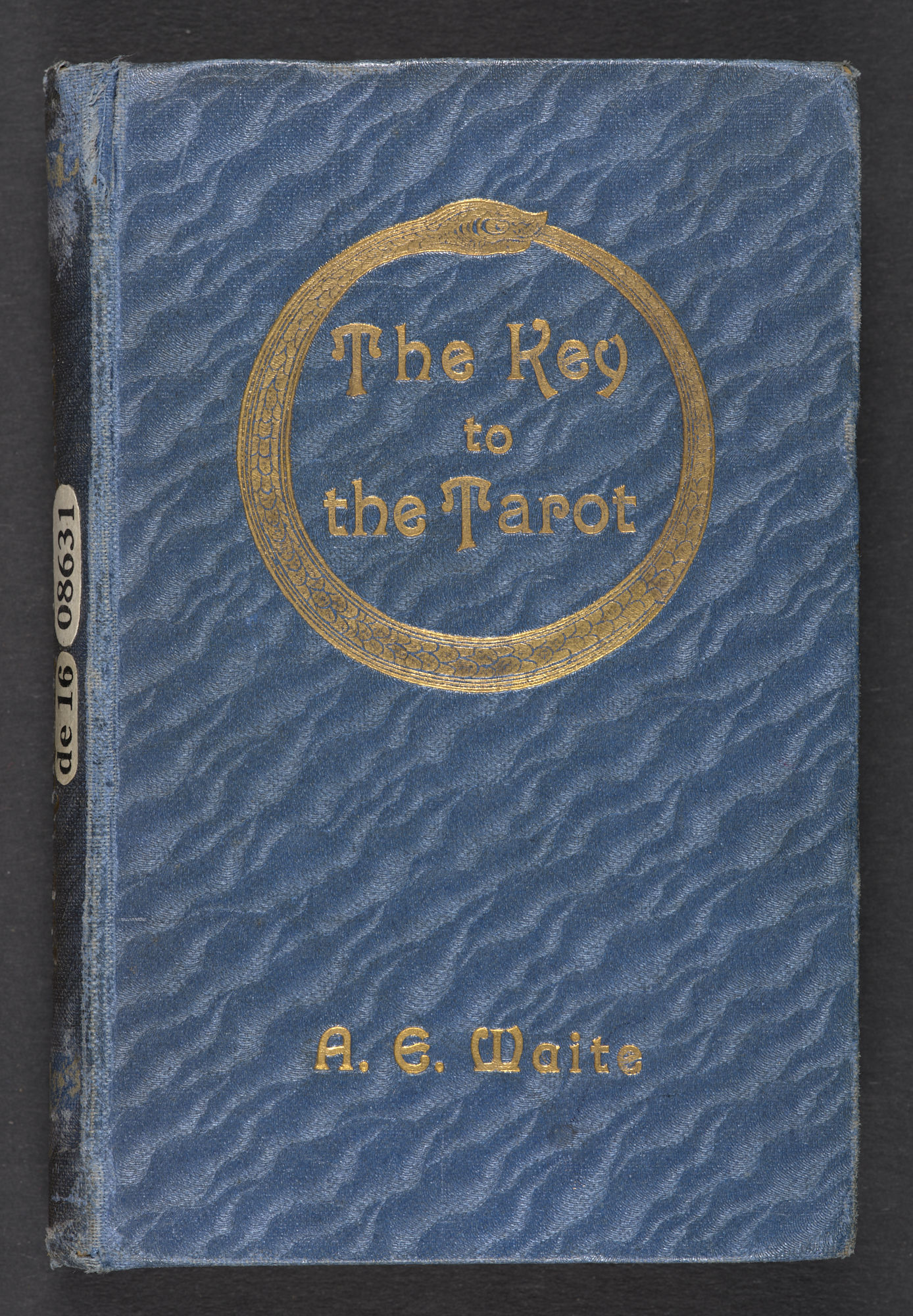 The cover of "The Key to the Tarot" by Arthur Edward Waite. An illustration of a snake encompasses the title, eating its tail to create a circle. 