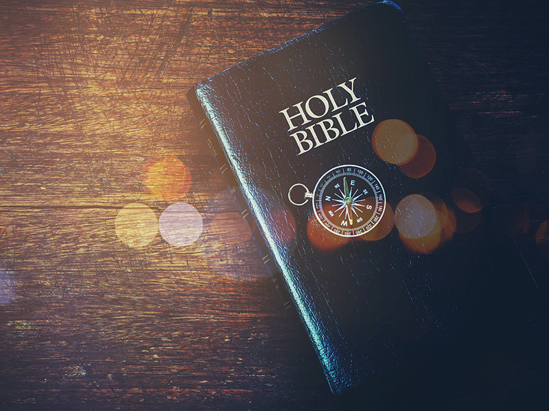 A photo of the Holy Bible on a table.