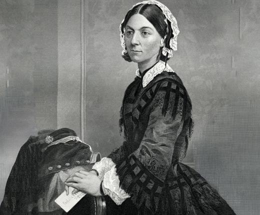A photograph of Florence Nightingale, holding a letter in her lap.