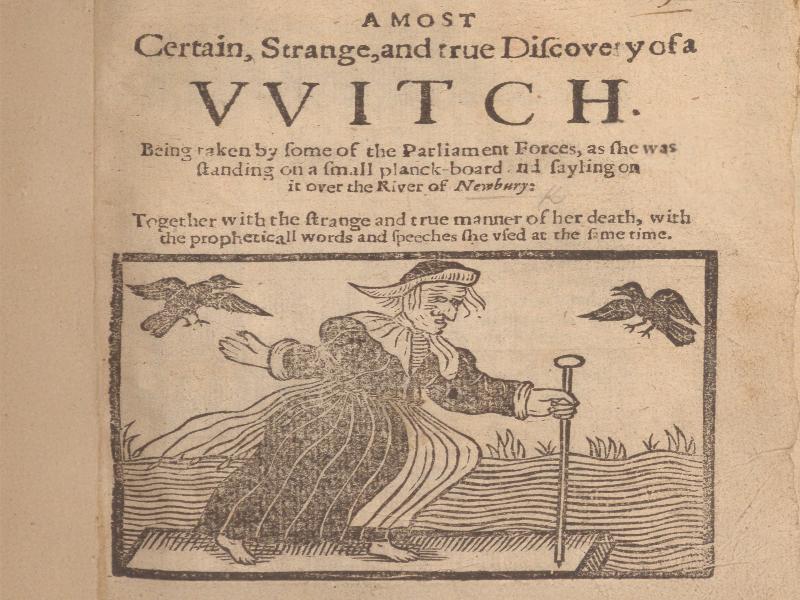 An illustration of a witch, holding a long stick, with two birds on either side of her. Above, text reads A most certain, strange and true Discovery of a Witch. Being taken by some of the Parliament Forces, as she was standing on a small planck-board and sayling on it over the River of Newbury: Together with the strange and true manner of her death, with the propheticall words and speeches she said at the same time.