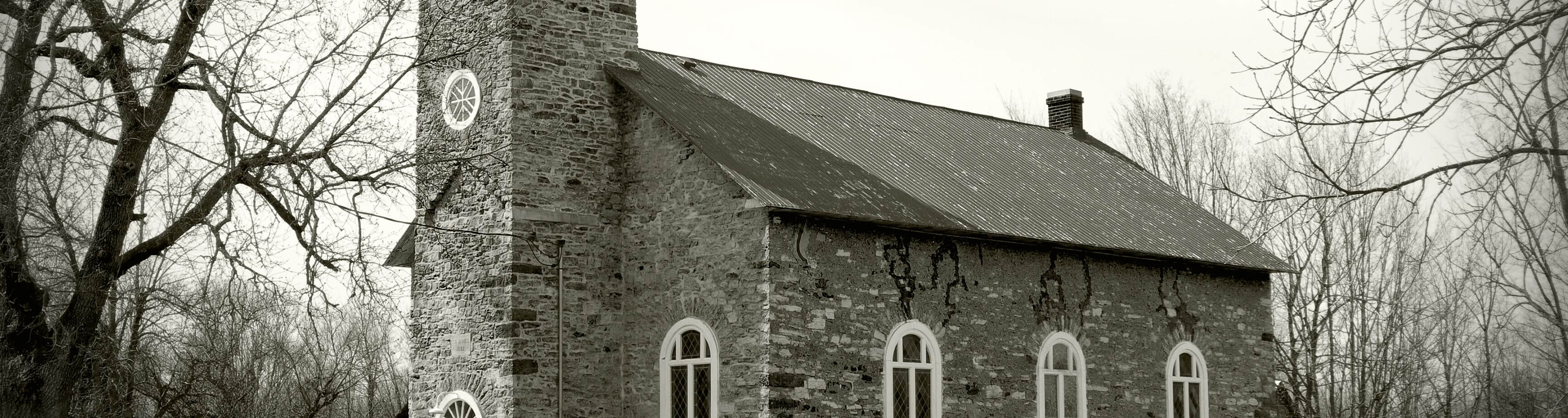 Photograph of an old, small, early 19th century, stone church.