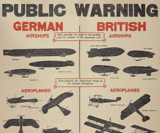 A poster from the First World War. It has a title of Public Warning, and underneath, two columns of drawings. The drawings are of German and British aircraft, which are separated under two headings written in red.