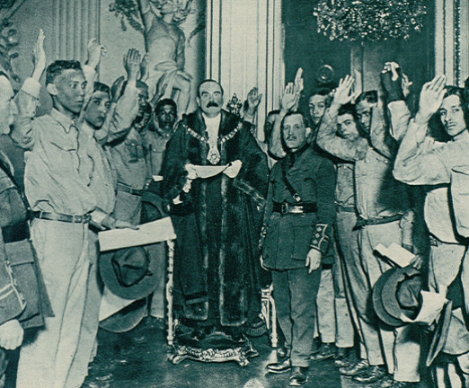 A photograph which shows recruits from Trinidad and Barbados being enrolled in the British West Indies Regiment (BWIR). During the First World War, thousands of men from the West Indies volunteered to support the British imperial war effort. The recruits are being sworn in before the Lord Mayor of London, Sir Charles Wakefield.