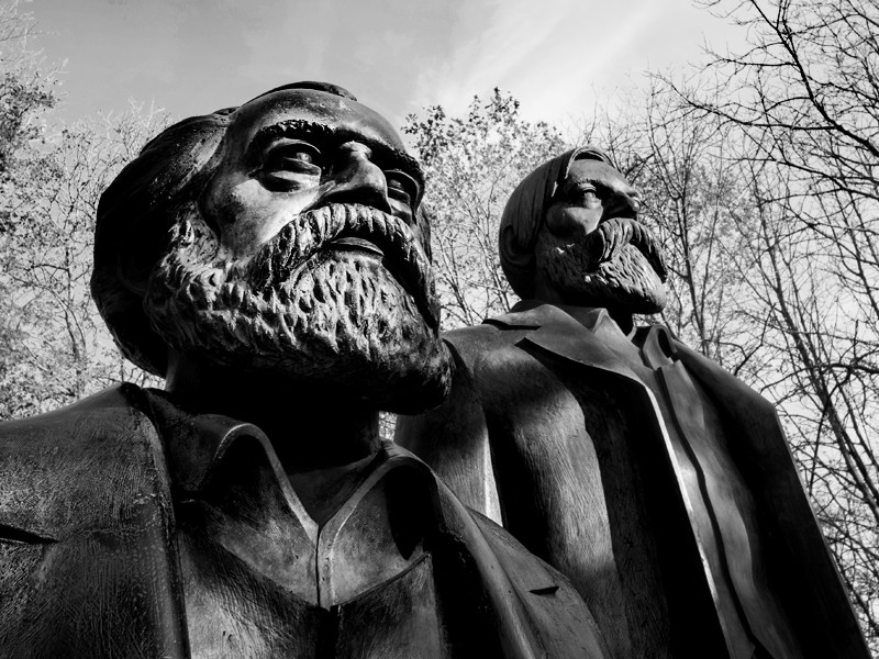 A black and white image of a statue of Marx and Engels.
