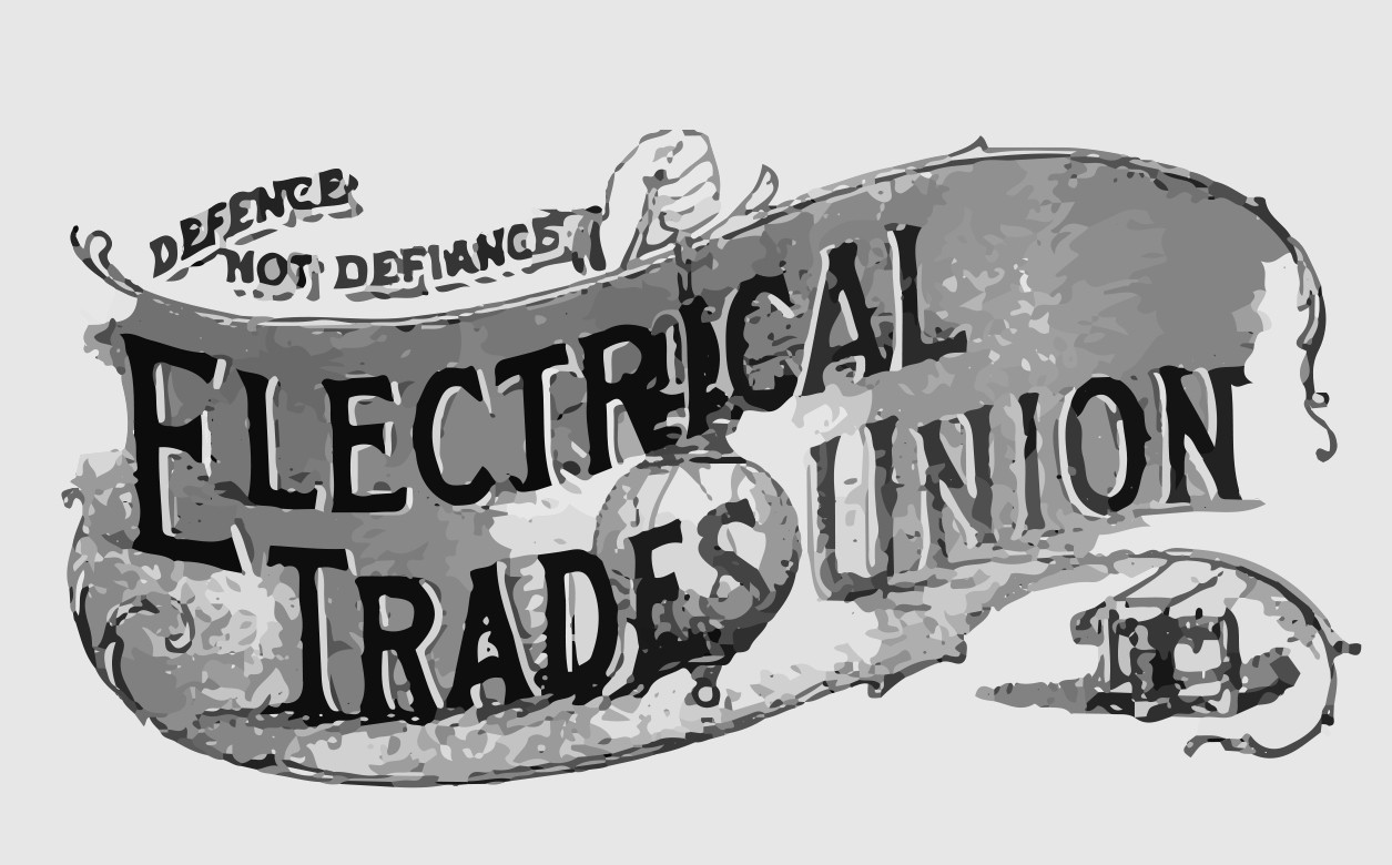 A banner sign from the Electrical Trades Union. In the centre it reads 'Electrical Trades Union', with 'Defence not Defiance' on the top left.