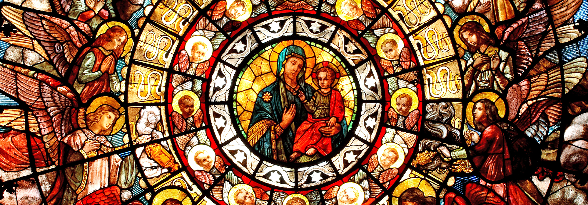 A photo of a stained glass window in a Church.