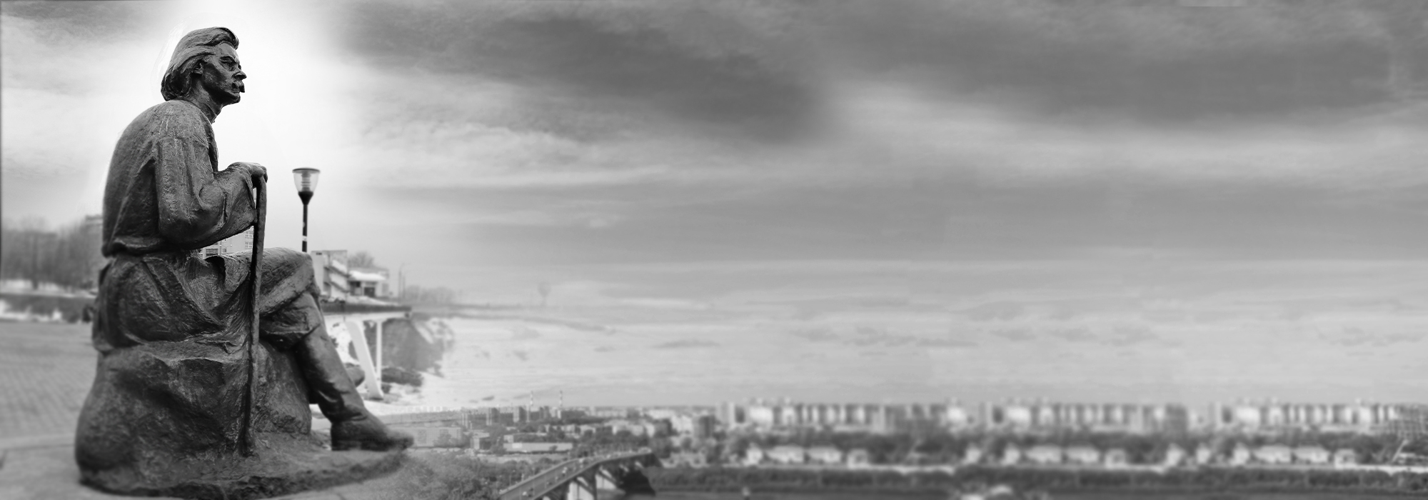 The monument to the Soviet writer Maxim Gorky. The statue is of Maxim Gorky sat down holding a walking stick.