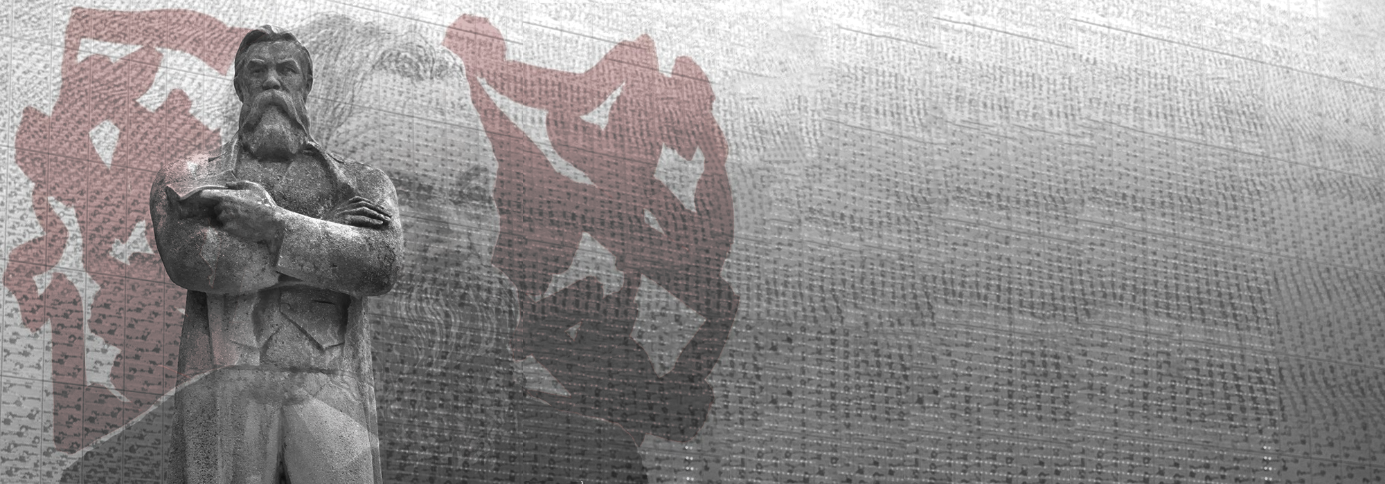 A black and white photo of the Friedrich Engels statue in Manchester.