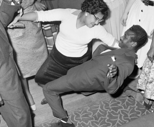 A black and white photograph of two people dancing.