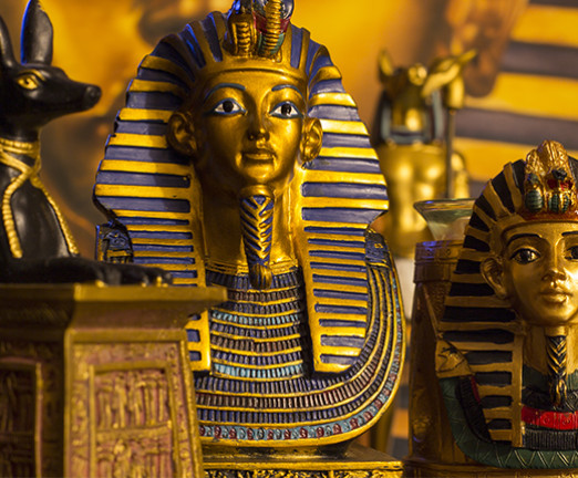 Statues of pharaoh Tutankhamun and mythology jackal.