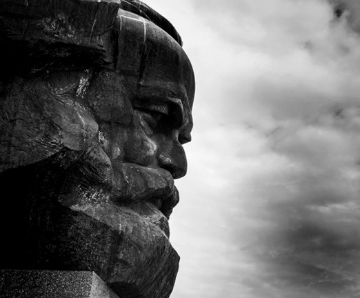 Photograph of the Karl Marx monument in Chemnitz - Saxony, Germany. A stone sculpture of Marx's head, viewed from the side.