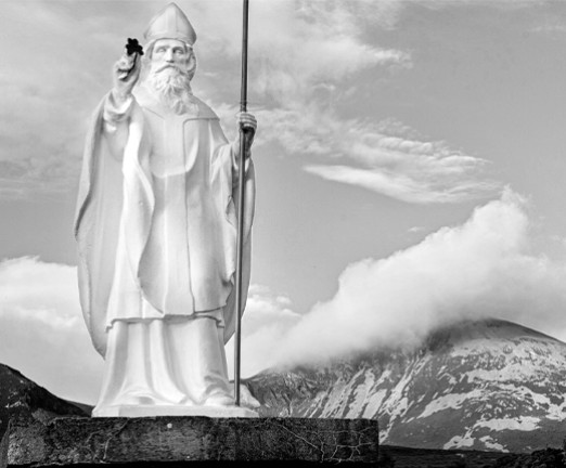 A white statue of St. Patrick.
