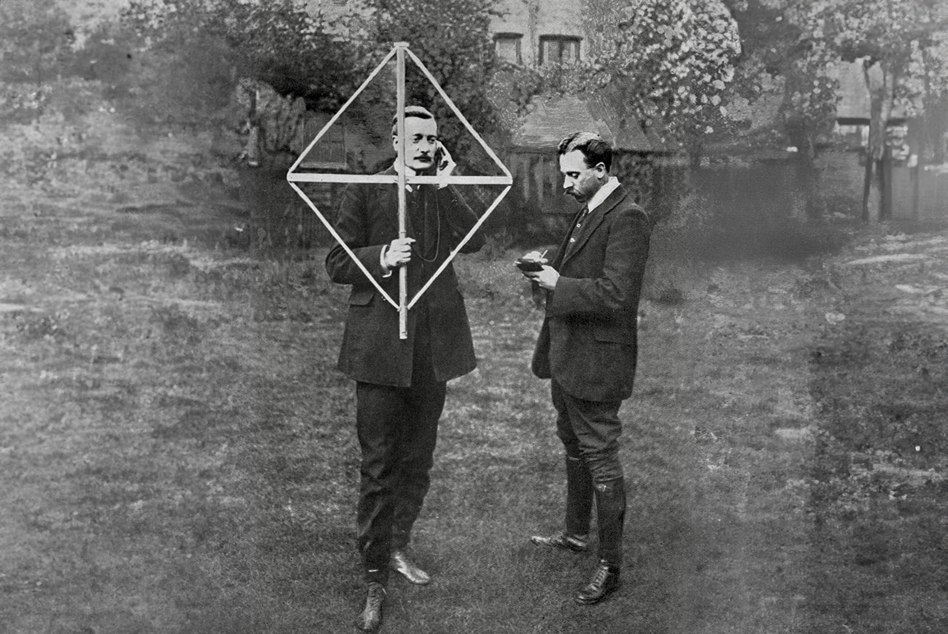 Photograph in The Bystander on 13 April 1910 titled "A Portable Wireless Station: Messages Received While You Walk in The Garden". Depicts two men in their garden holding a wireless transmitter.
