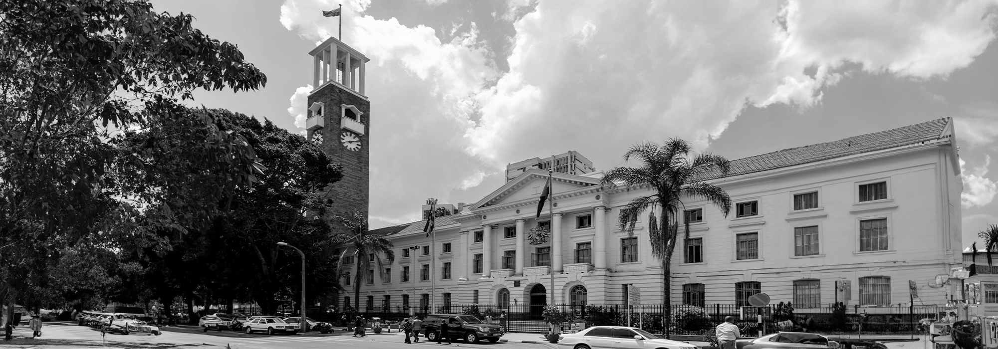A greyscale photograph of the front of the Nairobi city hall, capital of Kenya.