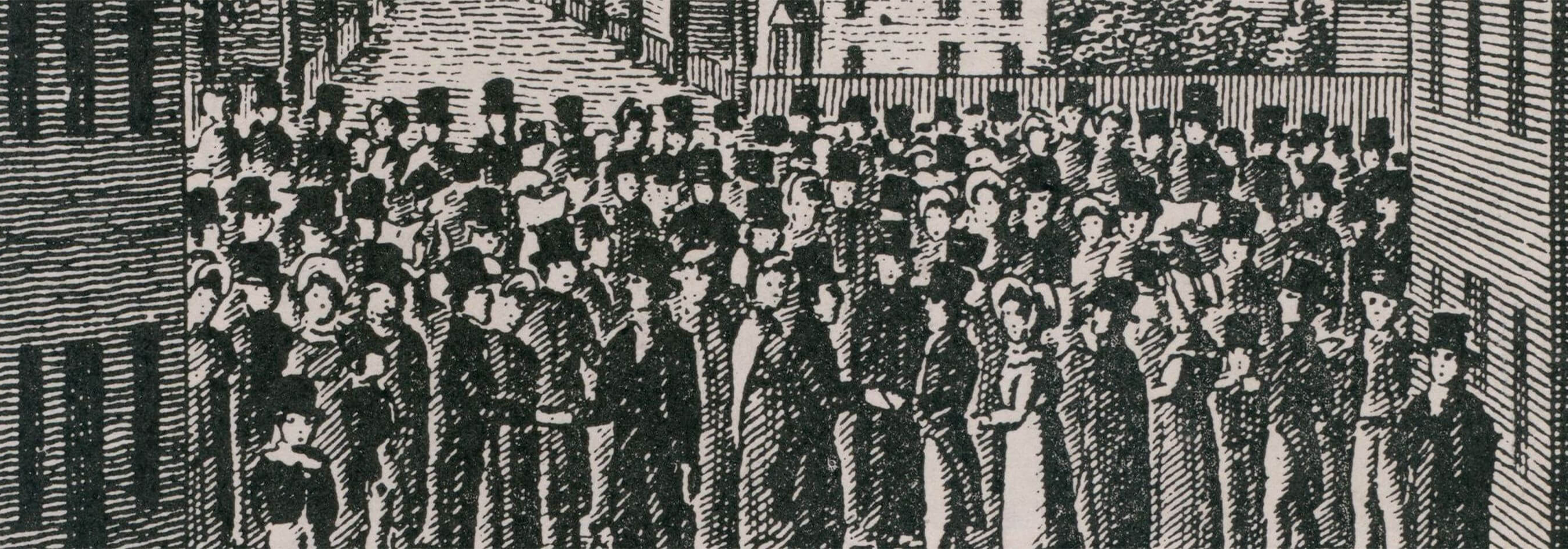 A crowd of people stand in a square surrounded by buildings. The people are wearing formal dress, including top hats and bonnets.