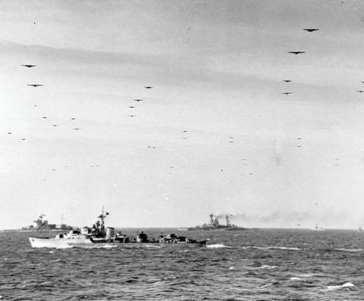 Glider borne troops crossing the Channel ships of the Royal Navy on June 6, 1944. In the background are the battleships Warspite and Ramillies.