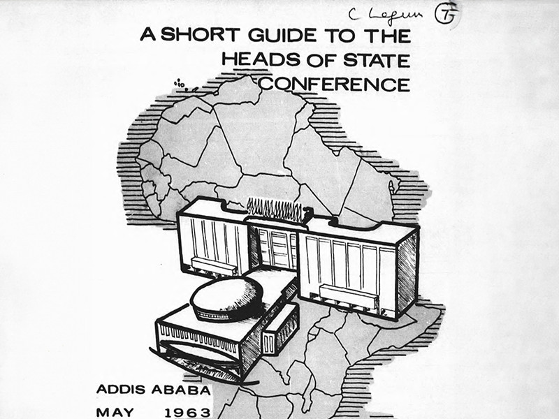 Section of the cover of A Short Guide to the Heads of State Conference dated May 1963. A map of Africa overlayed with an illustration of a building is in the center.