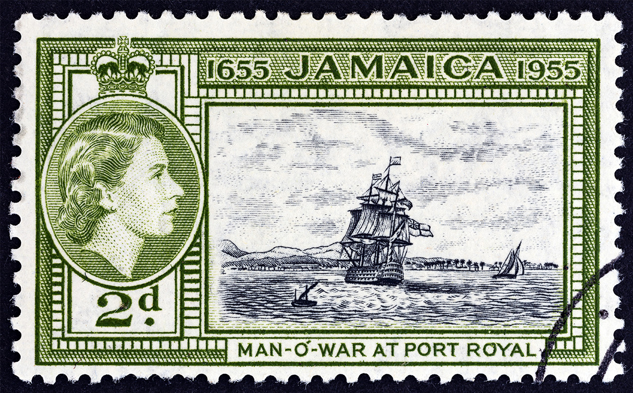 A stamp printed in Jamaica issued for the 300th Anniversary of Jamaica's Status as British Territory shows H.M.S. Britannia at Port Royal and Queen Elizabeth II, circa 1955.