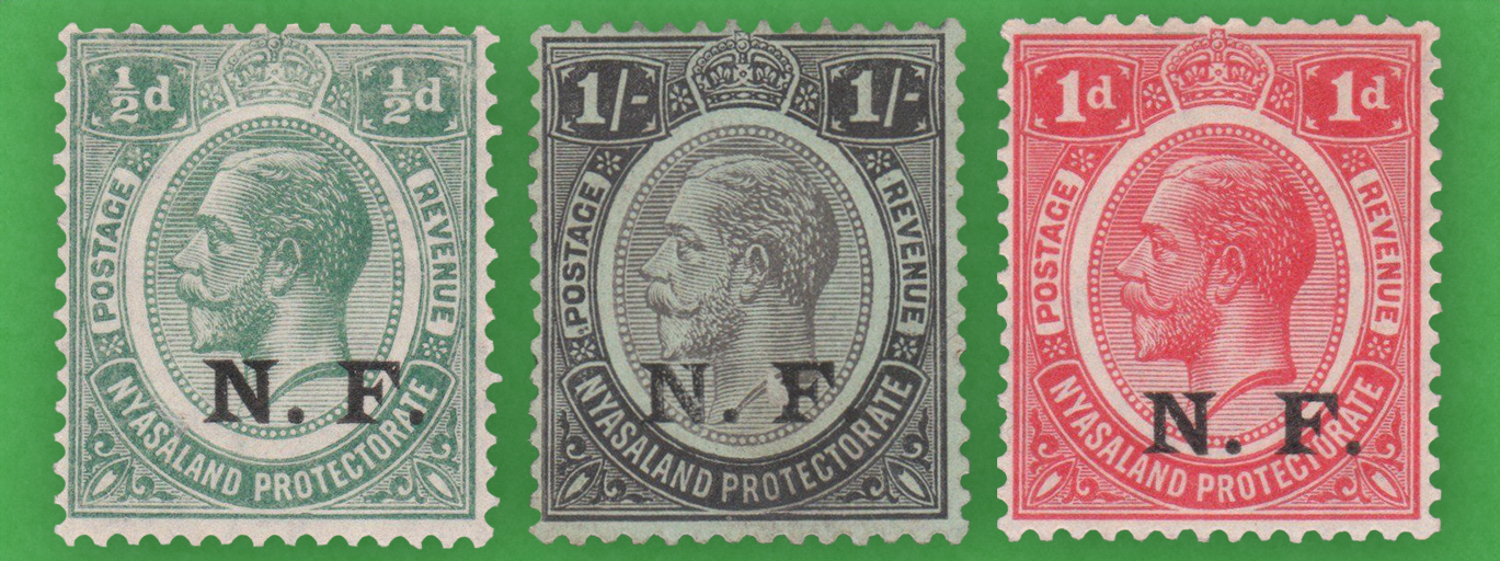 A collection of various coloured Nyasaland stamps with King George V's head printed on them.