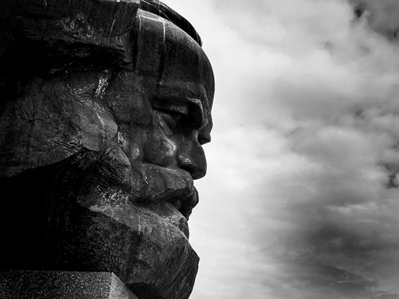 Image of the Karl Marx statue in Chemnitz, Germany, set against a cloudy sky