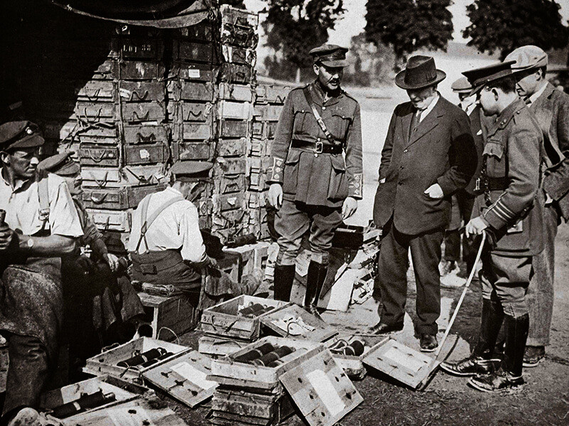 Mr Asquith watching men adjusting fuses, Somme campaign, France, World War I, 1916