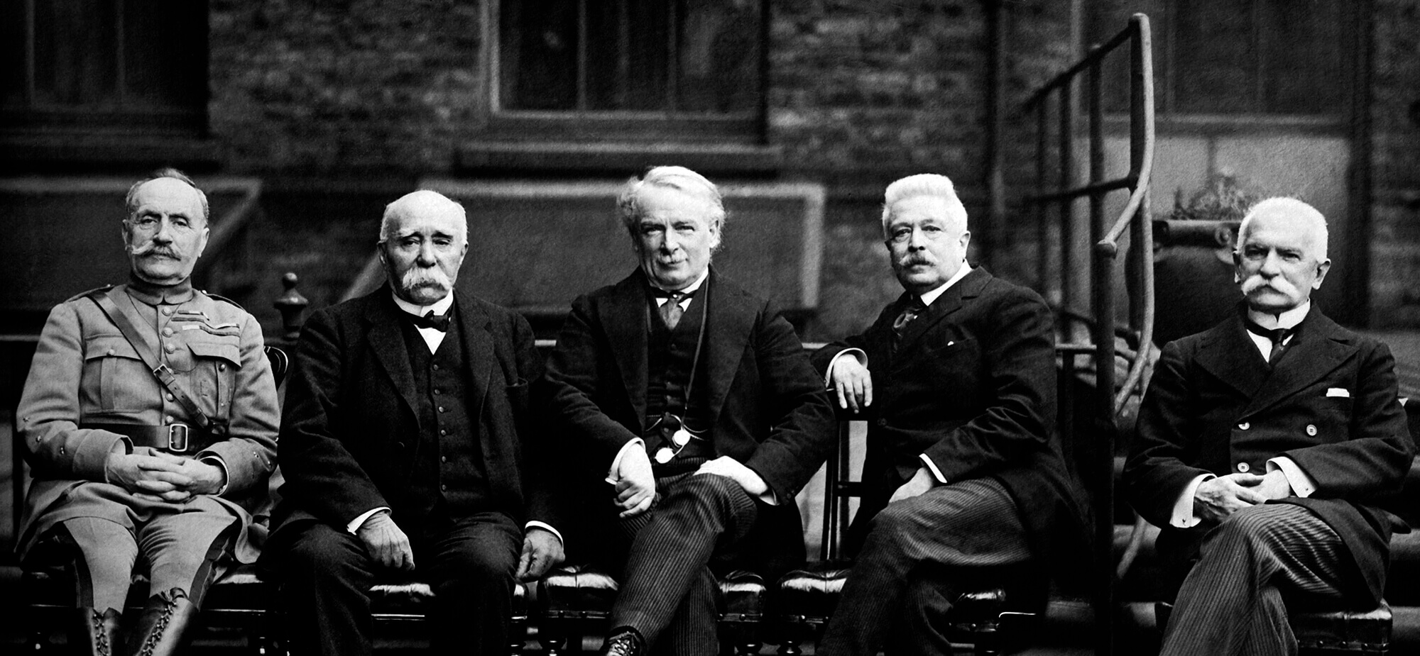 A black and white image of French, British and Italian ministers at the Paris Peace Conference.