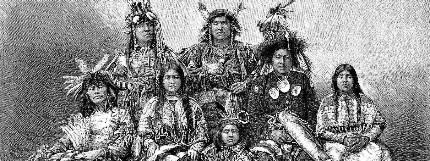 Native American warriors and their wives, arranged for a group sitting.