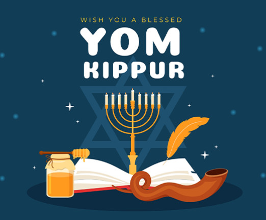 A menorah protrudes from an open book, with text that says Wish you a blessed Yom Kippur.