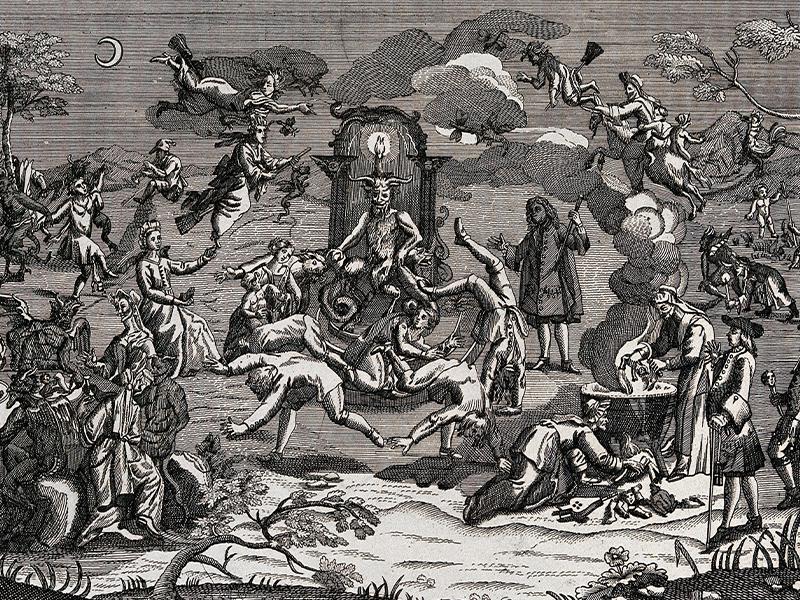 Illustration of Satan sat on a throne at the centre of a witches' sabbath. Several figures surround the throne, dancing acrobatically. On the right, people cook dismembered infants in a cauldron, while several humans and devils on the left eat at a table.