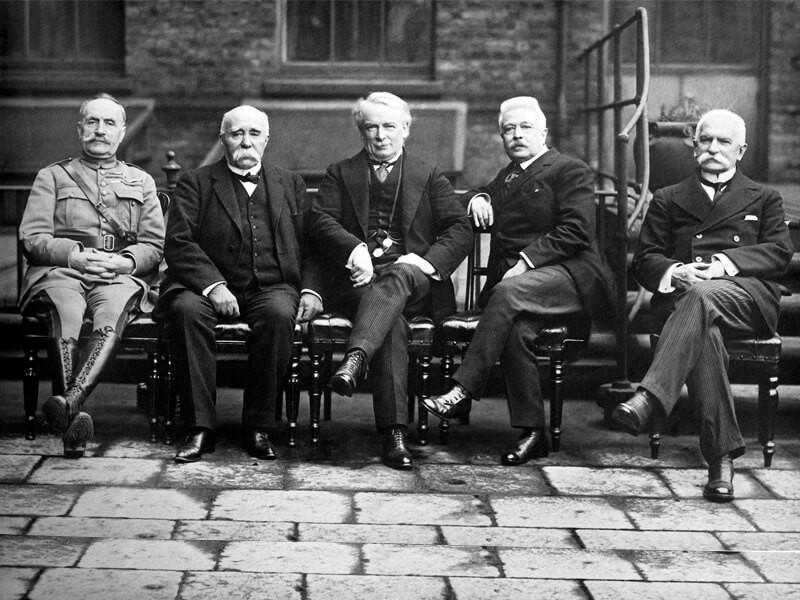 A black and white image of French, British and Italian ministers at the Paris Peace Conference.